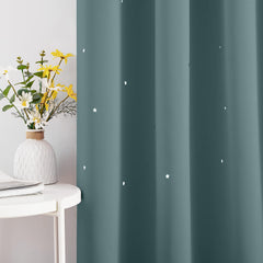 NICETOWN star cutouts filter light for gentle daytime glow in nursery