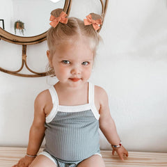 Niceye tiny bows worn in a ponytail or braids.