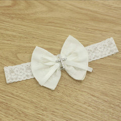 Nihao Baby ivory/off-white bow headband pairs with white dresses for coordinated looks.
