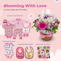 Nikki's Gift Baskets Deluxe Baby Blossom embroidered shirt highlights keepsake value for photos.