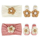 Nirvany baby headbands and socks set with flower accents for adorable photo moments.