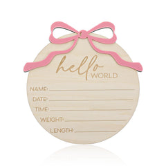 Nogeqi Hello World sign with pink bow serves as a charming baby photo prop keepsake.