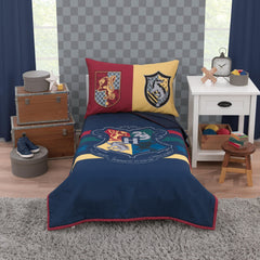 NoJo Harry Potter bed set comforter on toddler bed with Hogwarts colors for cozy sleep
