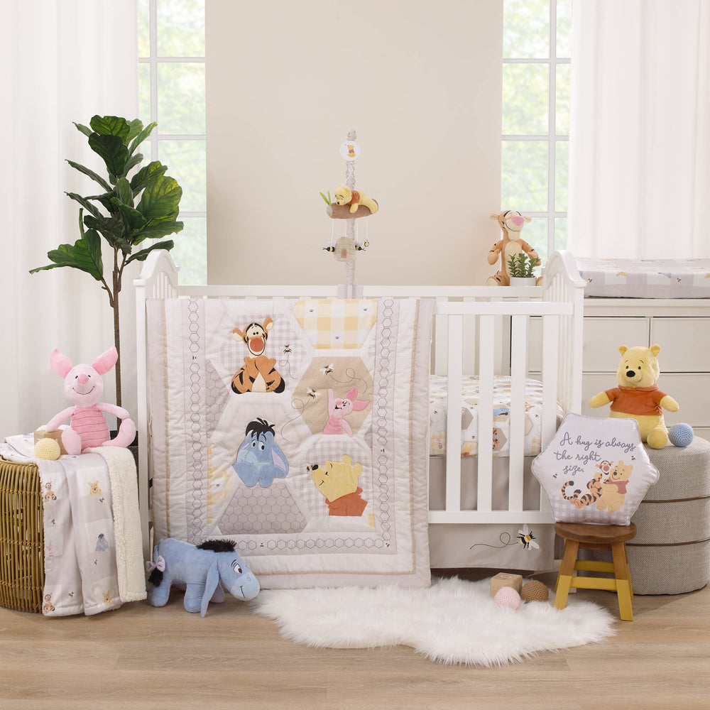 NoJo Winnie the Pooh Hugs & Honeycombs comforter close-up shows soft fabric for cuddles.