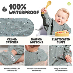 Nombear bib with elastic cuffs protects wrists during meals.