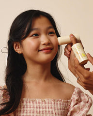 NOTHING FITS BUT bebe balm-stick closeup on face for gentle moisturization