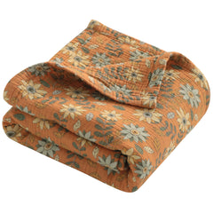 NTBAY 4-layer muslin blanket close-up fabric texture highlighting breathable comfort for babies.