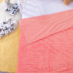 NTBAY flannel fuzzy toddler blanket pink draped on couch for cozy cuddle moments