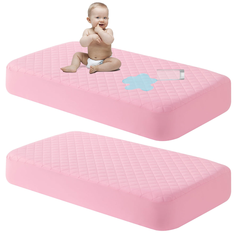 NTBAY mini crib mattress protector closeup showing snug fit and quiet fabric for restful sleep