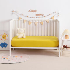 NTBAY mini-crib-sheet fit shows snug elastic for secure sleep