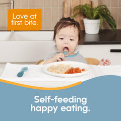 NumNum GOOtensils pre-spoon green in hand shows secure, non-slip self-feeding grip