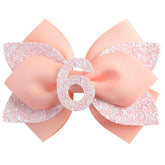 Nuolich glitter birthday bow peach front view for festive baby girl outfits.