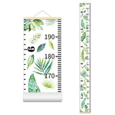 Nustila growth chart in kids room with beige frame for milestone tracking.