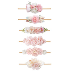 NUWAJP Flower Headband wearing-infant image demonstrates secure fit and comfortable elasticity.