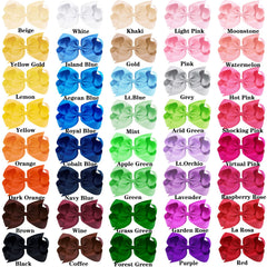 OAOLEER 6-inch bows on a toddler's head showing color variety