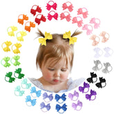 OAOLEER hair ties bows 2inch packaging shows a vibrant color assortment for versatile styling.