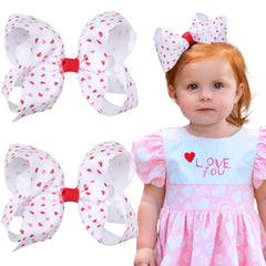 OAOLEER Valentine's Day pink heart bow clip securing toddler pigtails