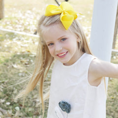 Oaooleer 4.5-inch yellow bow set as decorative hair accessory for matching outfits.