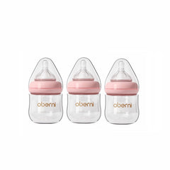 Oberni glass baby bottle close-up shows anti-colic system for smoother feeds.
