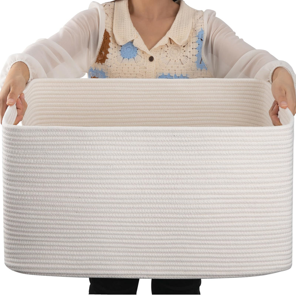 OIAHOMY 75L blanket basket on sofa showing ample storage for throws and pillows