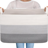 OIAHOMY large storage basket in gradient grey enhances living room organization.