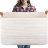 OIASKET 95L blanket basket stores blankets for organized living room storage.
