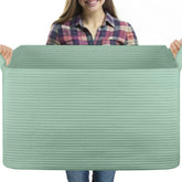 OIASKET 95L blanket basket top view showing ample blanket storage for a tidy living room.