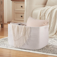 OIASKET white basket fits living-room decor while holding blankets or towels.