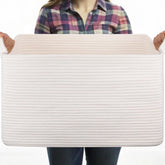 OIASKET white storage basket organizing blankets and toys for a tidy living room.