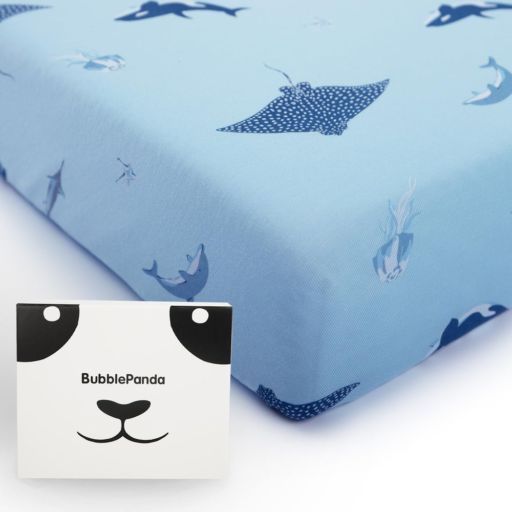 BubblePanda bamboo crib sheet flatlay highlights shark pattern and premium softness.