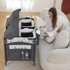 Okaytwins Twin Bassinet shows two removable bassinets for versatile sleep options.