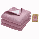 okdiy violet-white muslin blanket folded for cozy on-the-go snuggling