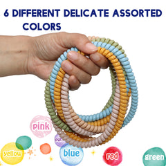 Olugu chewy necklace closeup, durable coils in vivid colors for everyday wear.