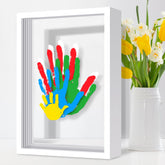 Omrhvi family handprint kit in wooden frame highlights a cherished family memory for years