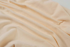 Onacosht fabric close-up—double jersey knit cotton texture for breathable, skin-friendly touch.