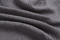 Onacosht close-up shows soft breathable muslin texture ideal for newborn skin.