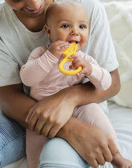 oogiebear 360° teether yellow close-up focuses on bristles for tactile sensory teething.