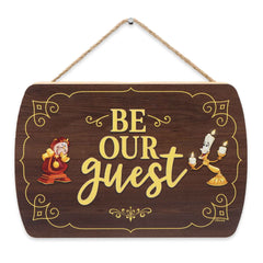 Open Road Brands Be Our Guest wall decor wood sign closeup highlighting classic typography on wood grain