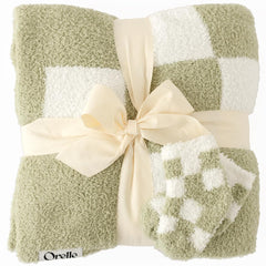 Orelle checkered baby blanket in sage green—soft fabric for cozy crib time.