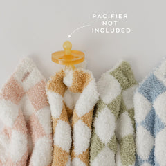 Orelle checkered lovey pacifier attachment demonstrates safe, simple pacifier retention on the go