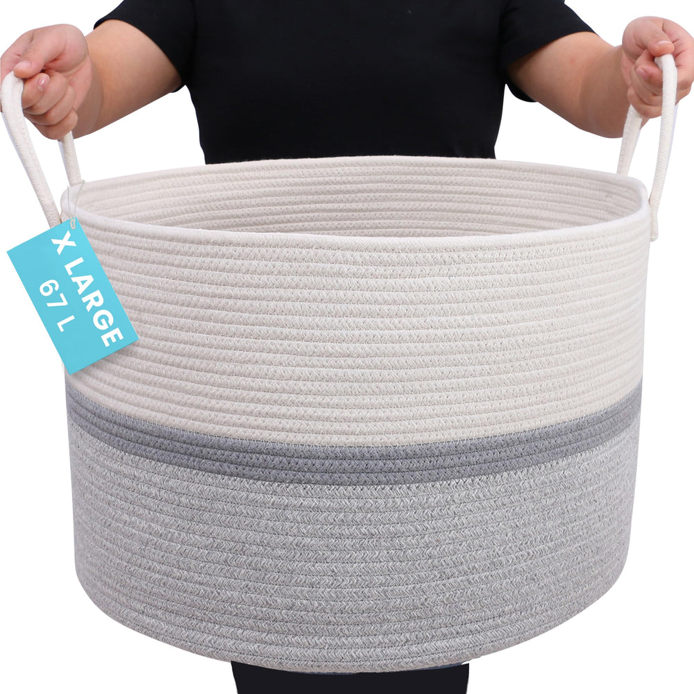 OrganiHaus large woven storage basket with gray stripe holds blankets neatly in living rooms.