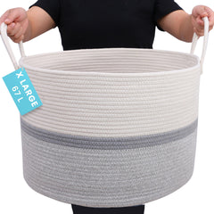 OrganiHaus large woven storage basket with gray stripe holds blankets neatly in living rooms.