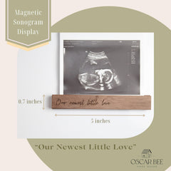 Oscar Bee baby-announcement frame supports 4x6 and 5x7 photos.