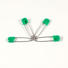 OsoCozy locking head nappy pin demonstrates secure fastening during washing