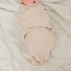 Ouch Baby organic cotton swaddle knit closeup showing breathable fabric for sensitive skin.