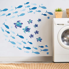 Outus blue fish wall decor set adds vibrant underwater motion to any space.