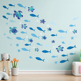 Outus sea turtle wall decals with 12 turtles and bubbles for a playful coastal scene in kids' rooms.