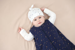 Owlivia sleep sack Starry Sky being worn illustrates comfortable sleeveless fit for cool weather.