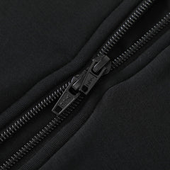 Baby wearing Owlivia sleep sack in black, size 3-12 months.