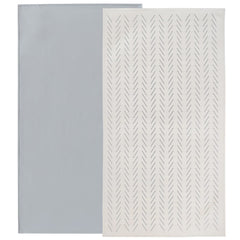 Owlowla baby changing pad folded in gray herringbone for travel convenience